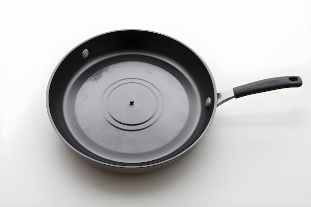 Photo a black frying pan with a hole in the middle of it