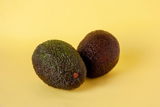 Black and green avocado on a light background selective focus