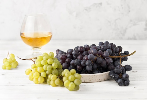 black and green grapes with wineglass