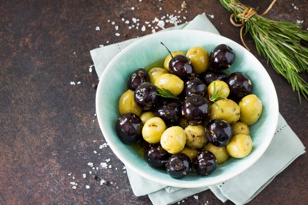 Black and green olives in a bowl