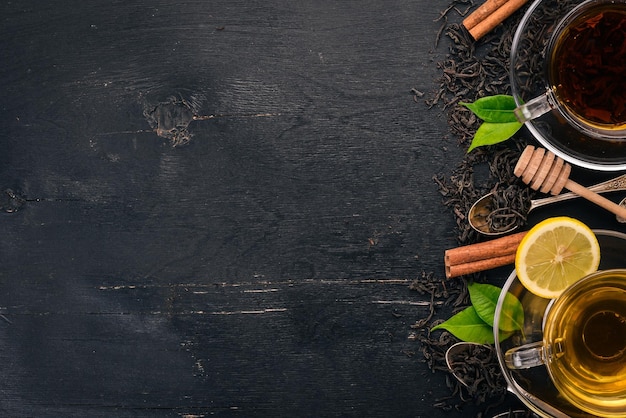 Black and green tea with lemon honey cinnamon and ginger Hot drink Top view Copy space