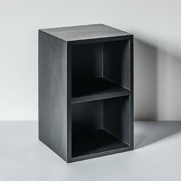 a black and grey book shelf with a black box on the bottom