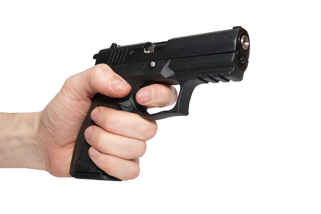 Black gun in a hand isolated on white background