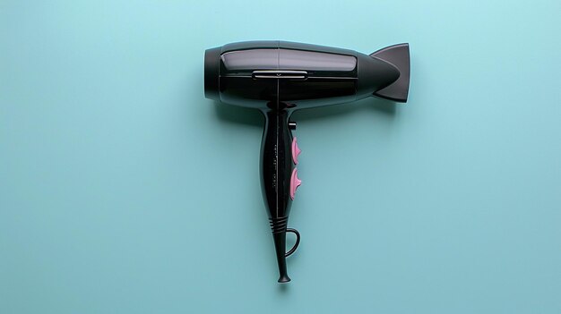 Photo a black hair dryer with a red tag on it is on a blue wall