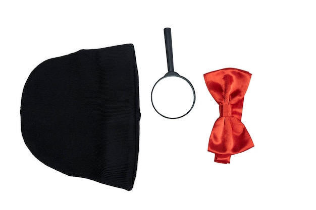 Black hat magnifying glass and red bow tie