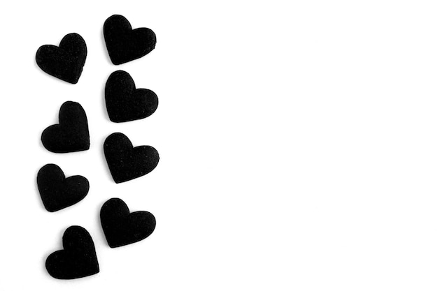 Black hearts on the white background