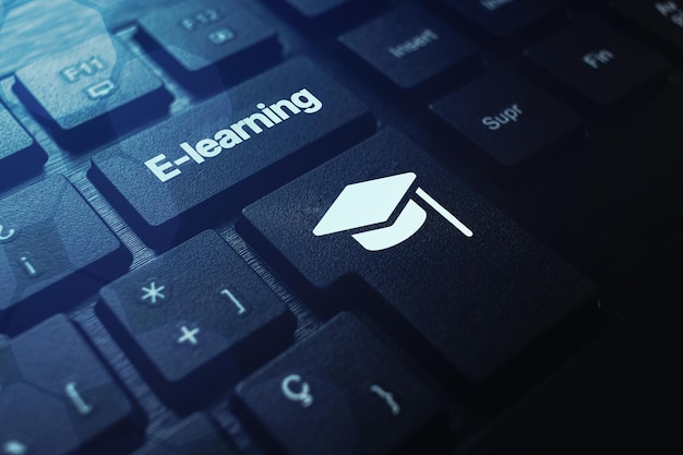 Black keyboard with E-learning word on button and graduation cap. Webinar. Online education.