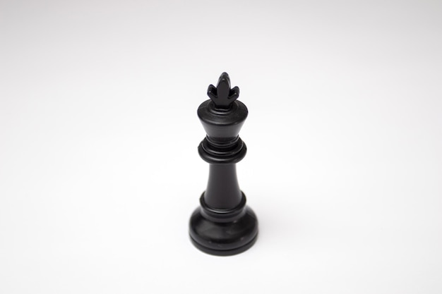 Black King chess piece on white background.