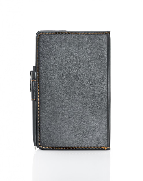 Black leather note book and pen isolated