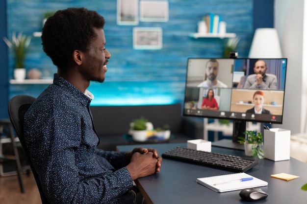 Black man doing online conference video call