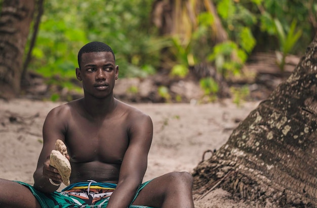 Black man holding stones in hand