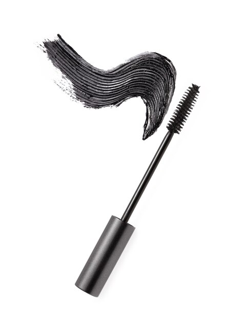 Black mascara brush stroke with applicator brush