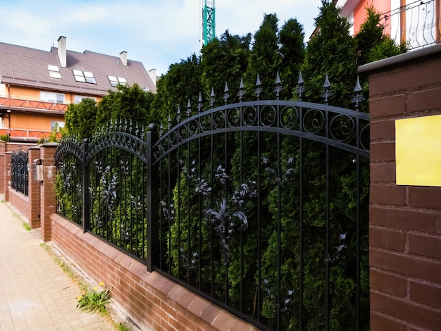 black metal fence with gate