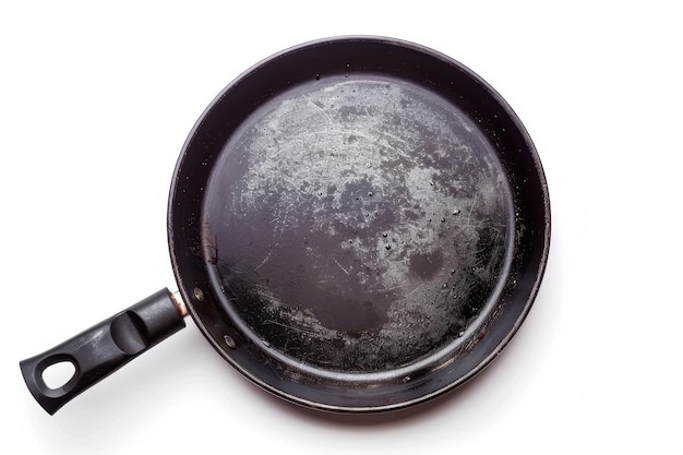 Photo black metal pan with non stick coating isolated on white background