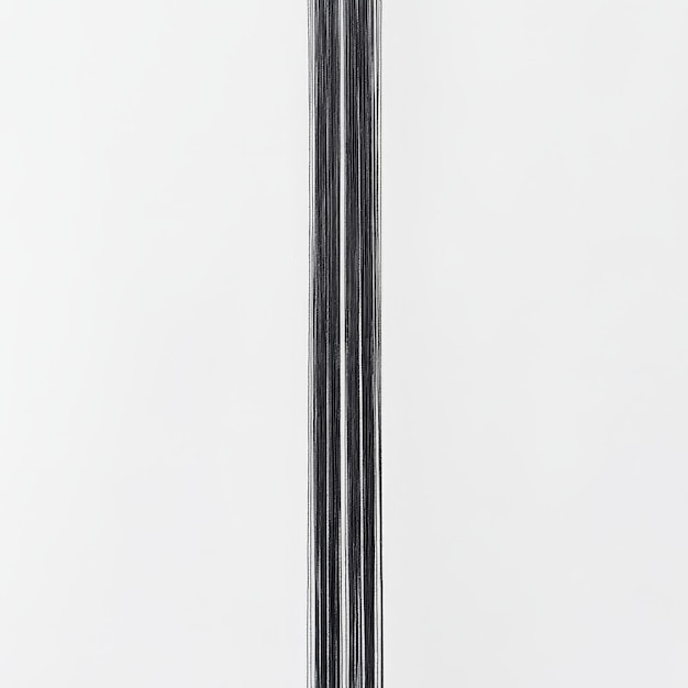 Photo a black metal pole with a white background that says  the number 6