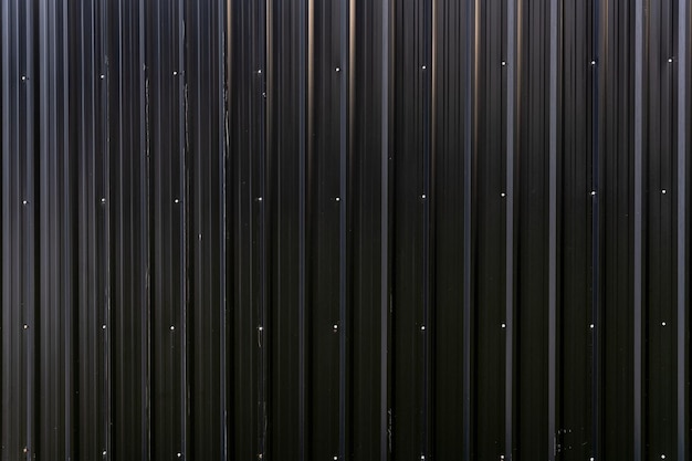 Black metal shiny fence sheet of construction site