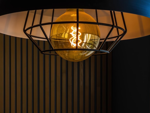 black minimalist loft chandelier with LED filament lamp close up