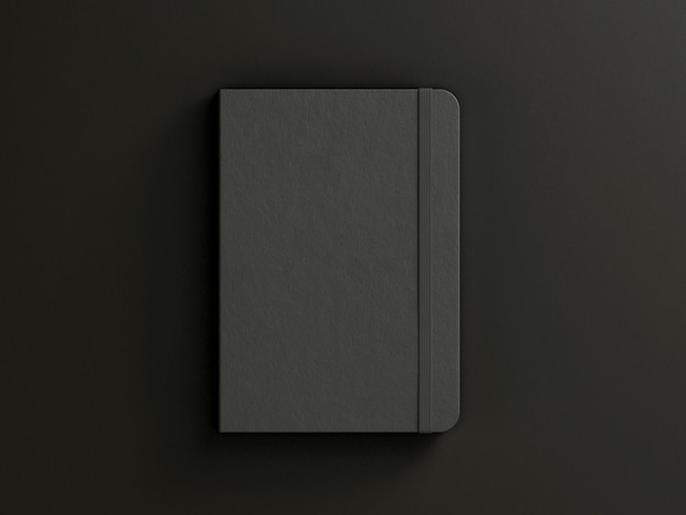 Black moleskine isolated on the black background