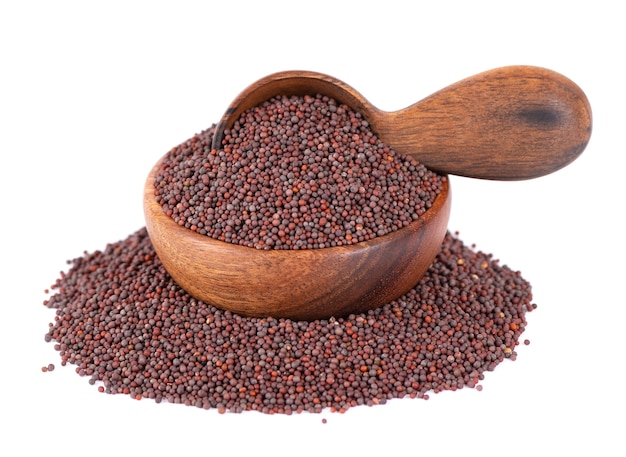 Black mustard seeds in wooden bowl and spoon isolated on white background