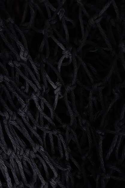 Black net on black background. Suitable for posters, covers, banners, and other marketing purposes.