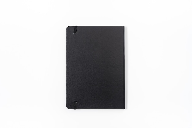 Black notebook on white background with clipping path