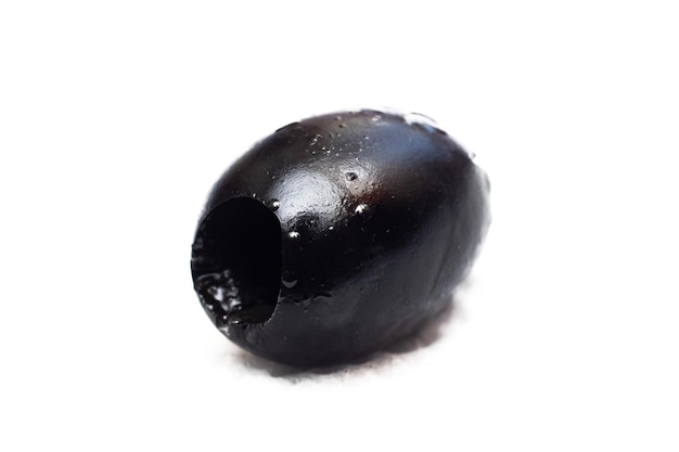 Black olive close up isolated on white background