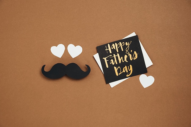 Black paper moustache with a greeting card