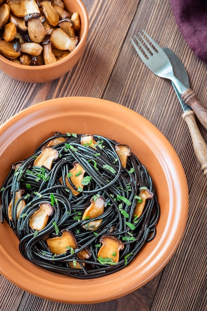 Black pasta with mushrooms