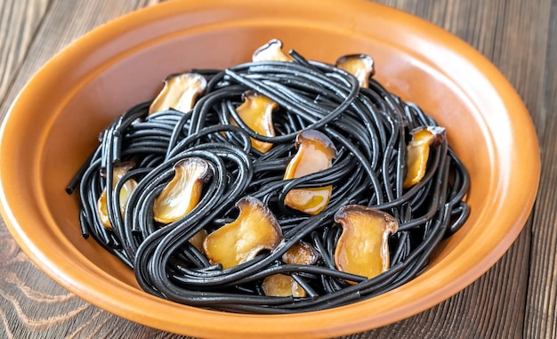 Black pasta with mushrooms