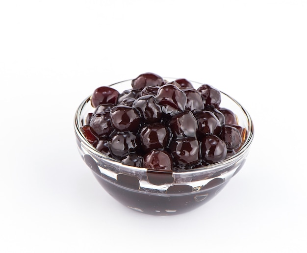 Black pearls. Boiled tapioca pearls for bubble tea on white background. Copy space