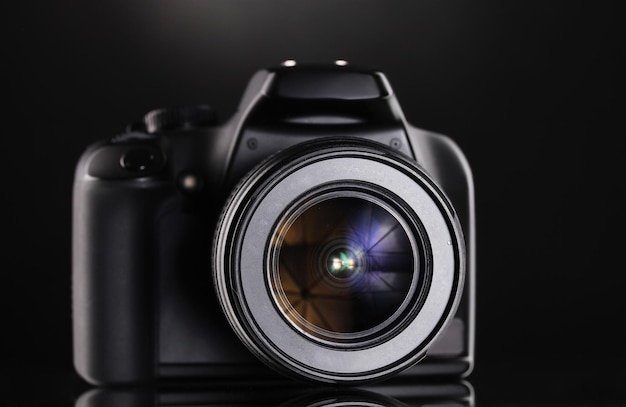 Black photocamera on black background