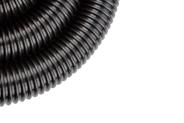 Black plastic corrugated vacuum cleaner hose on white background