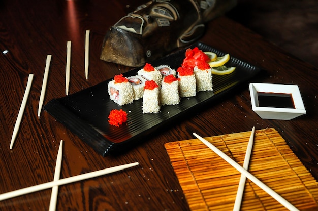 Black Plate With Sushi and Chopsticks