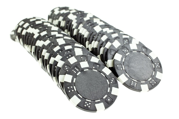 Photo black poker chips heap isolated