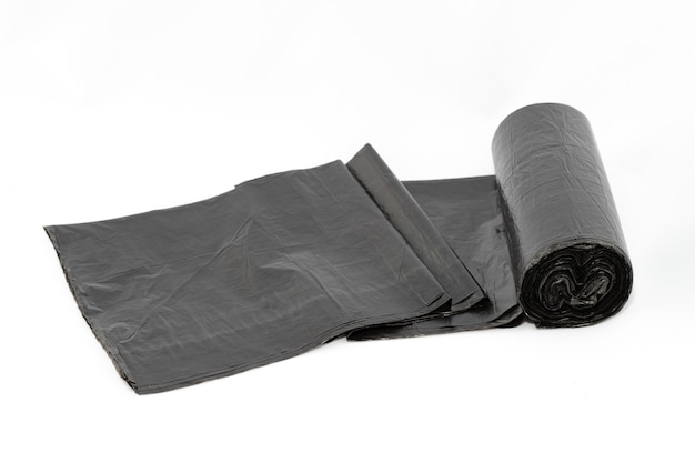 Black polyethylene garbage bags on white background