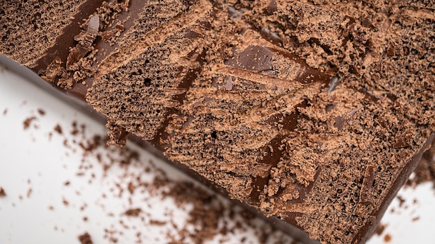 Black porous chocolate pieces close-up