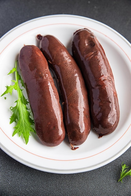 Photo black pudding fresh bloody sausage meal food snack on the table copy space food background rustic