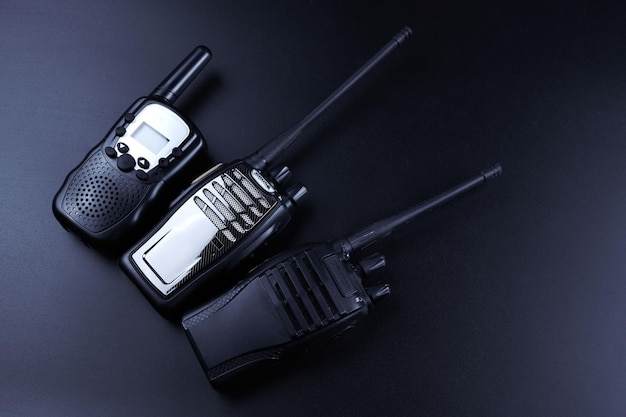 Black rectangle portable device with antenna isolated on black background radio transceiver set for communication radio set walkietalkie