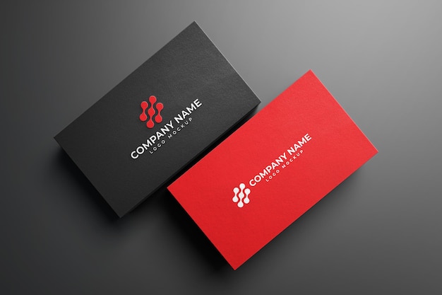 Black and Red Embossed Business Card on Dark Background