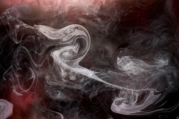 Black and red ink background colorful fog abstract swirling ocean acrylic paint pigment underwater white smoke