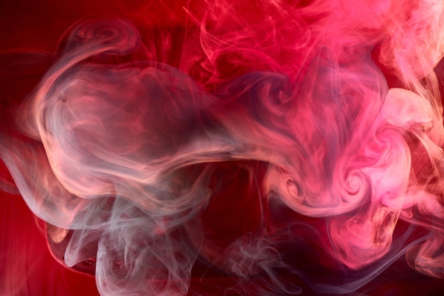 Black and red ink background colorful fog abstract swirling ocean acrylic paint pigment underwater white smoke