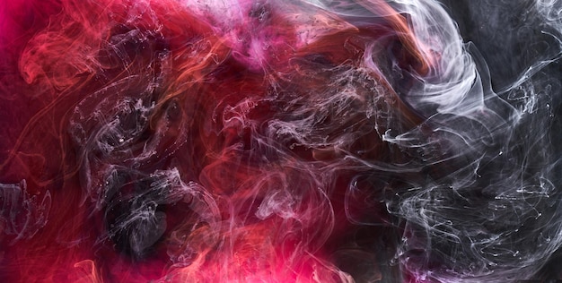 Black and red ink background colorful fog abstract swirling ocean acrylic paint pigment underwater white smoke