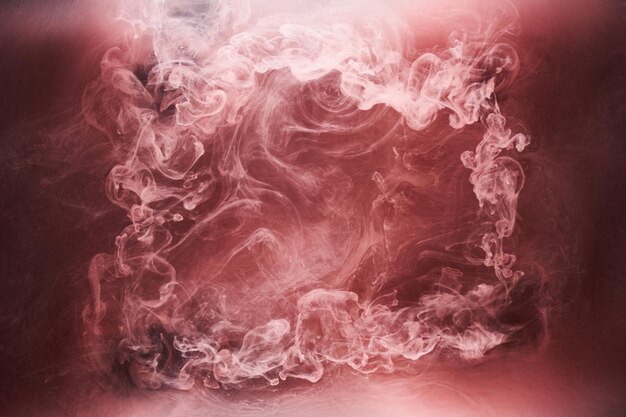 Black and red ink background colorful fog abstract swirling ocean acrylic paint pigment underwater white smoke