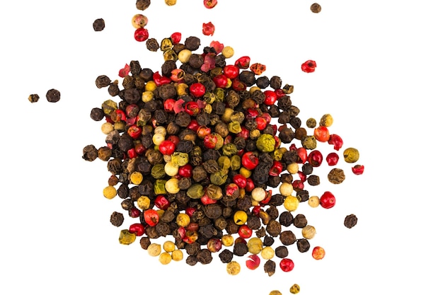 Black, red and white peppercorns isolated on white background. Heap of spice. Mix of different peppers.