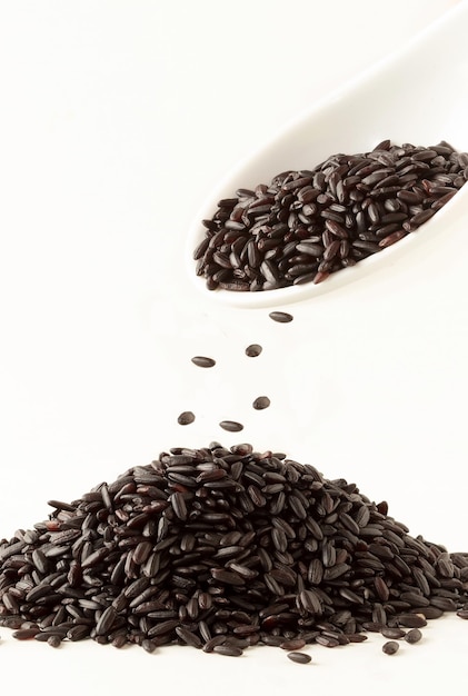 Black rice falling on pile