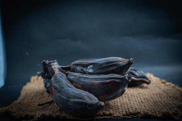 Black rotten Banana comb on a Sack