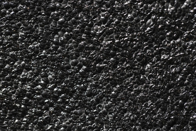 Black rough concrete gravel wall background texture