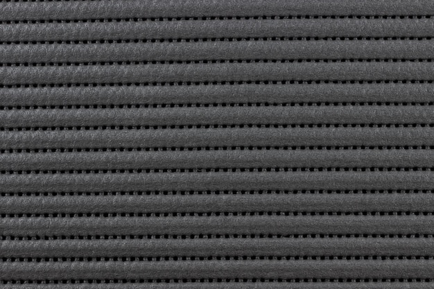 Black rubber perforated surface background