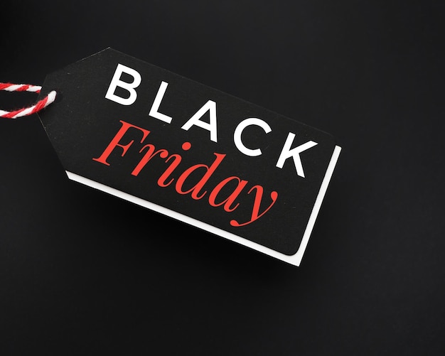 A black sale tag on a black background with the words Black Friday