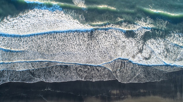 The black sand beach in Iceland. Sea aerial view and top view. 